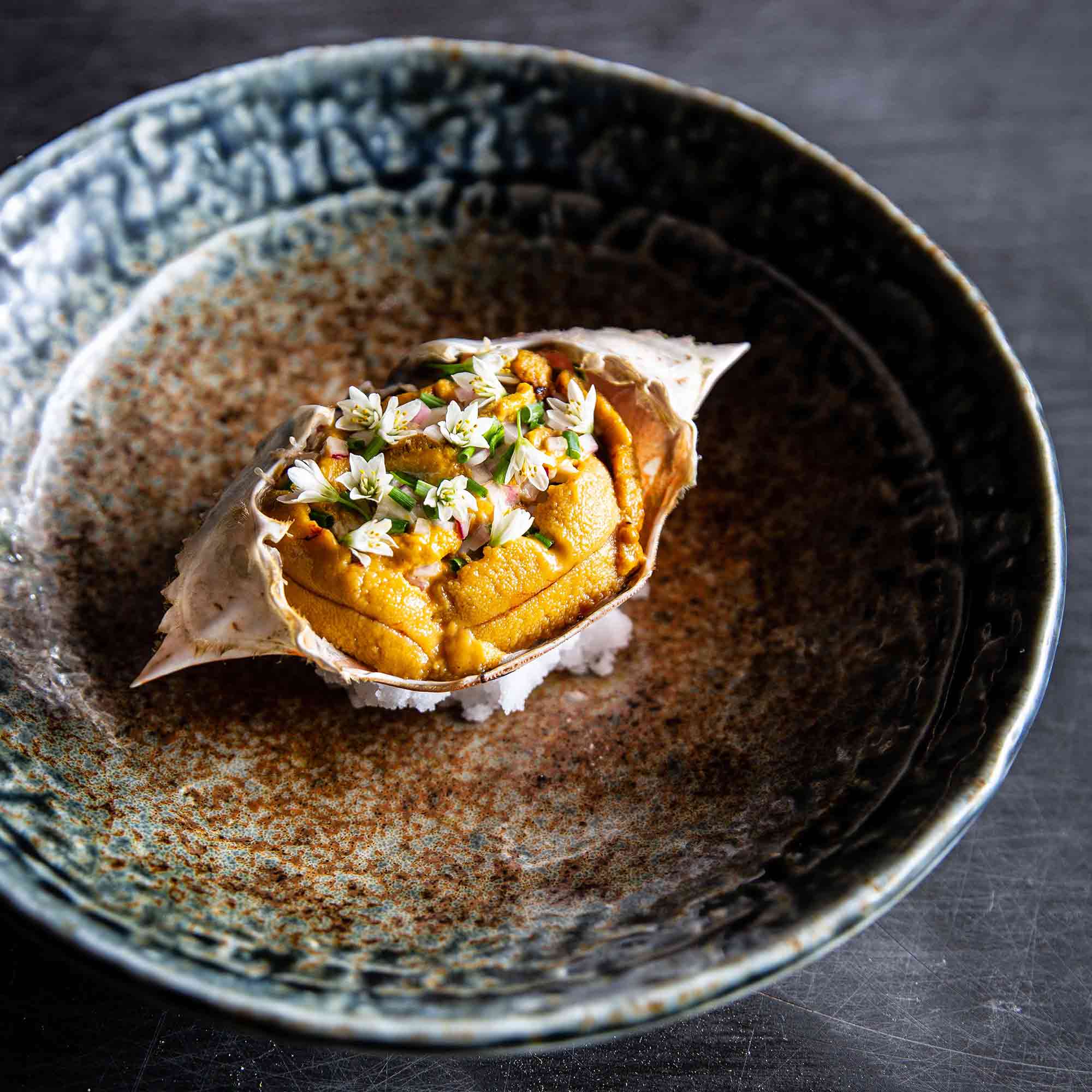 BLUE SWIMMER CRAB SALAD WITH SEA URCHIN MAYONNAISE, UNI GOLD, OSETRA CAVIAR, CHIVES AND GARLIC FLOWERS