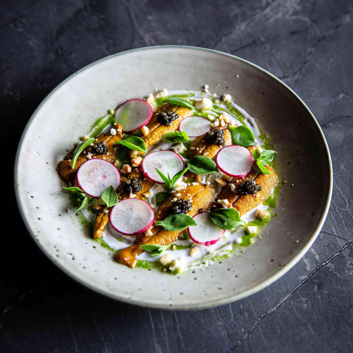 Sea Urchin with Osetra Caviar, Coconut Cream, Coriander Oil, Radish & Cashew